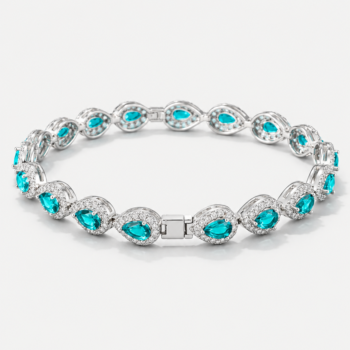 Zilverkleurige Armband met Turkooise Druppelvormige Stenen